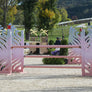 blue and pink ombre horse jump standards with pink jump poles