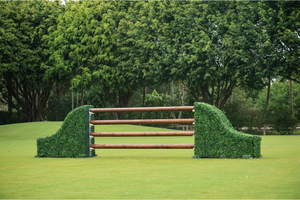 Arched turf hunter standards with natural wooden poles