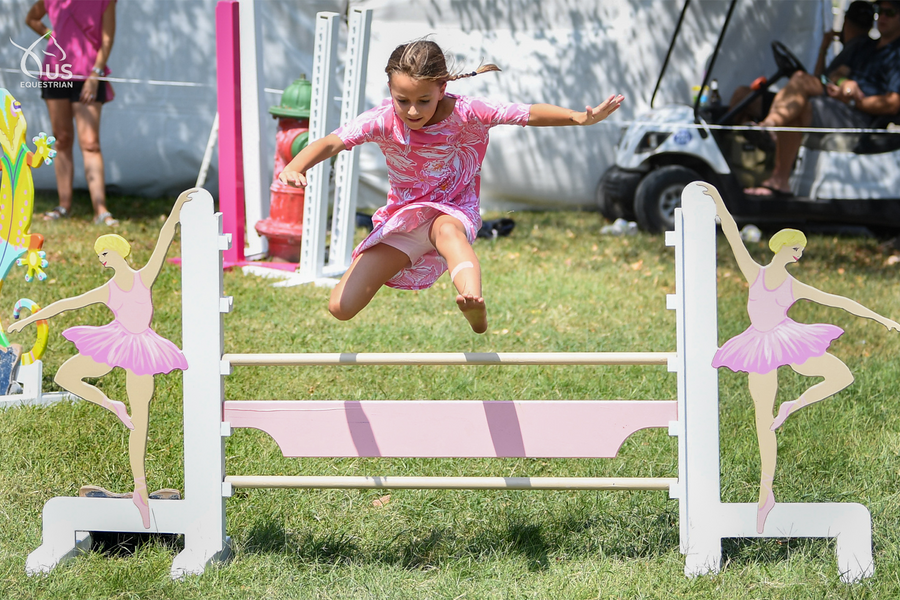 Ballerina kid and dog jump